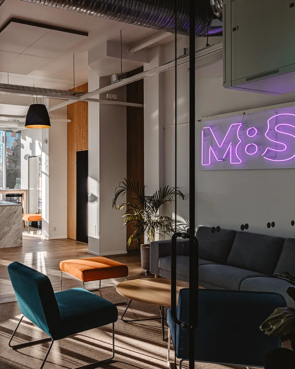Lounge area with the M8S neon sign